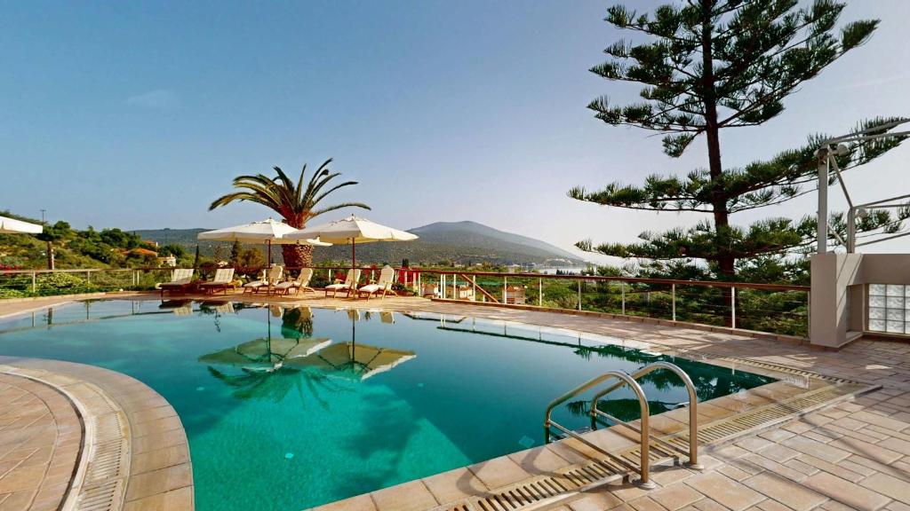 a swimming pool with a view of a mountain at Epidavros Villas - Gardenia Garden Retreat with Shared Pool in Nea Epidavros