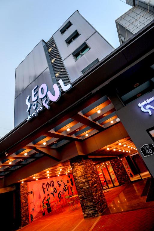 a building with a sign on the side of it at Hotelarrive Seoulful in Seoul