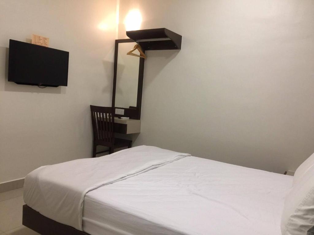 Postel nebo postele na pokoji v ubytování Hi Star Hotel
