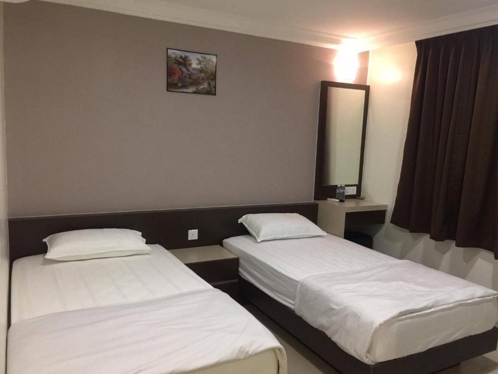 Postel nebo postele na pokoji v ubytování Hi Star Hotel