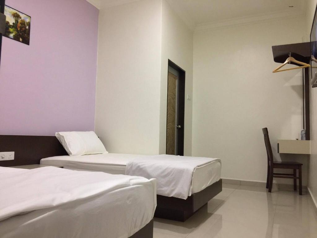 Postel nebo postele na pokoji v ubytování Hi Star Hotel