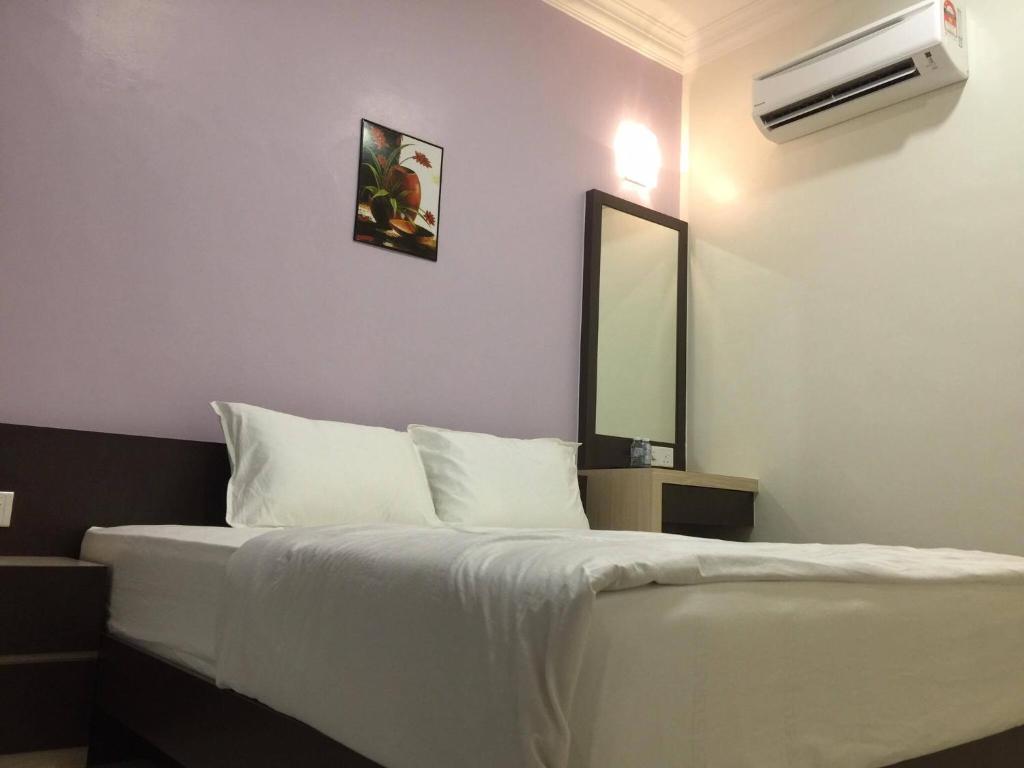 Postel nebo postele na pokoji v ubytování Hi Star Hotel