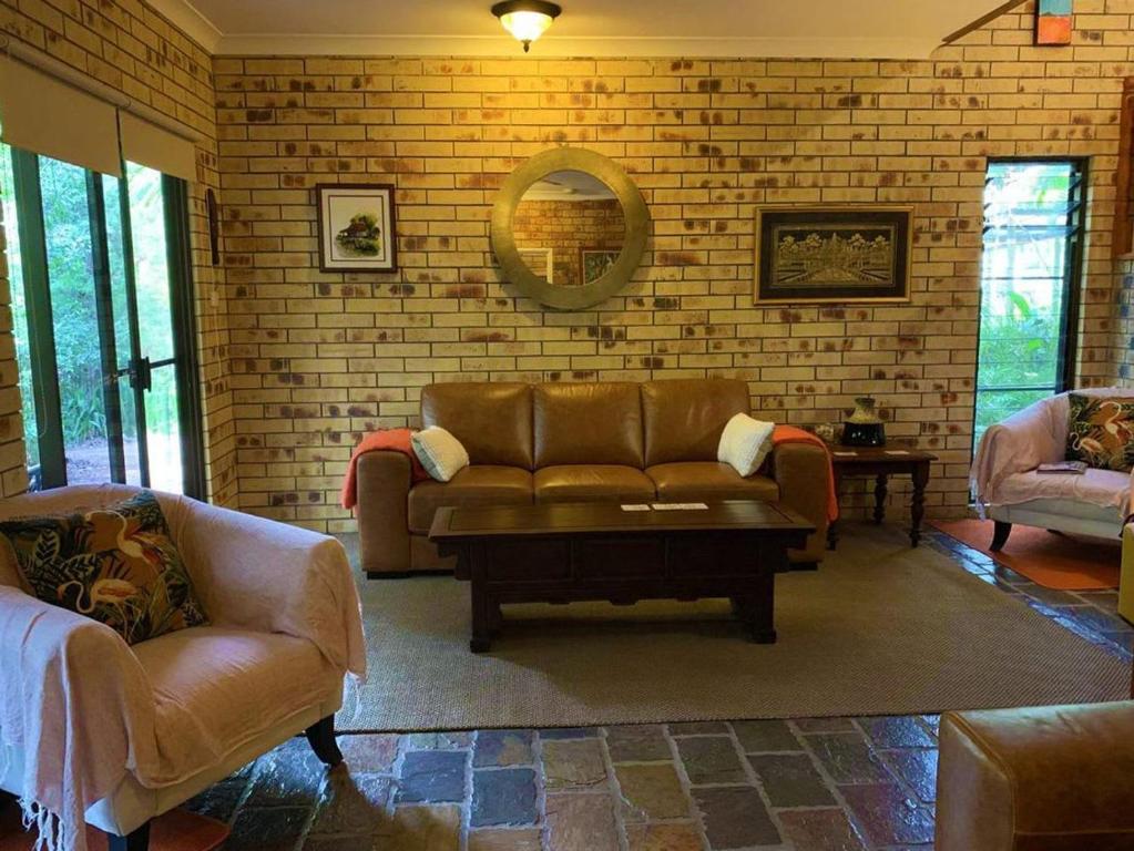a living room with a couch and a table at Avalon in Arcadia