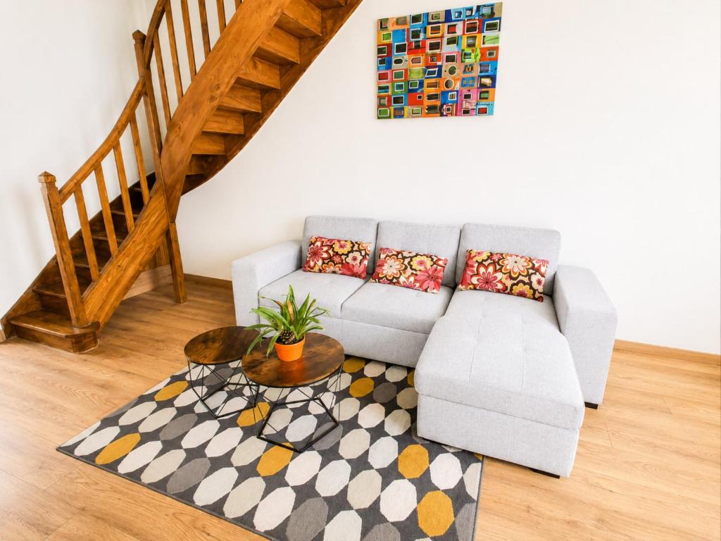 a living room with a couch and a table at Maison 6 pers - Entre mer & Mont-Saint-Michel in Beauchamps