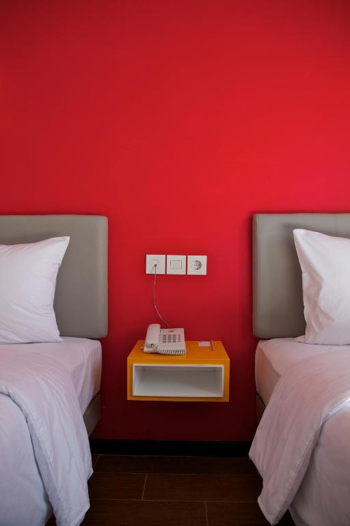 Postel nebo postele na pokoji v ubytování Amaris Hotel Padang