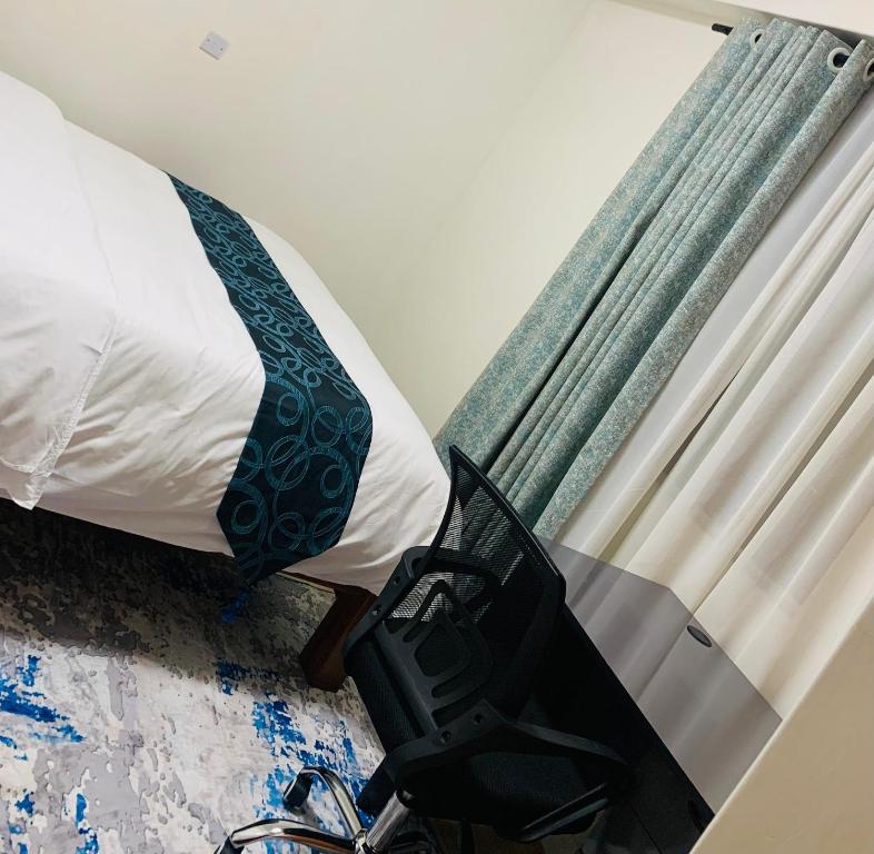 a bedroom with a bed and a window with a camera at property in Kisii