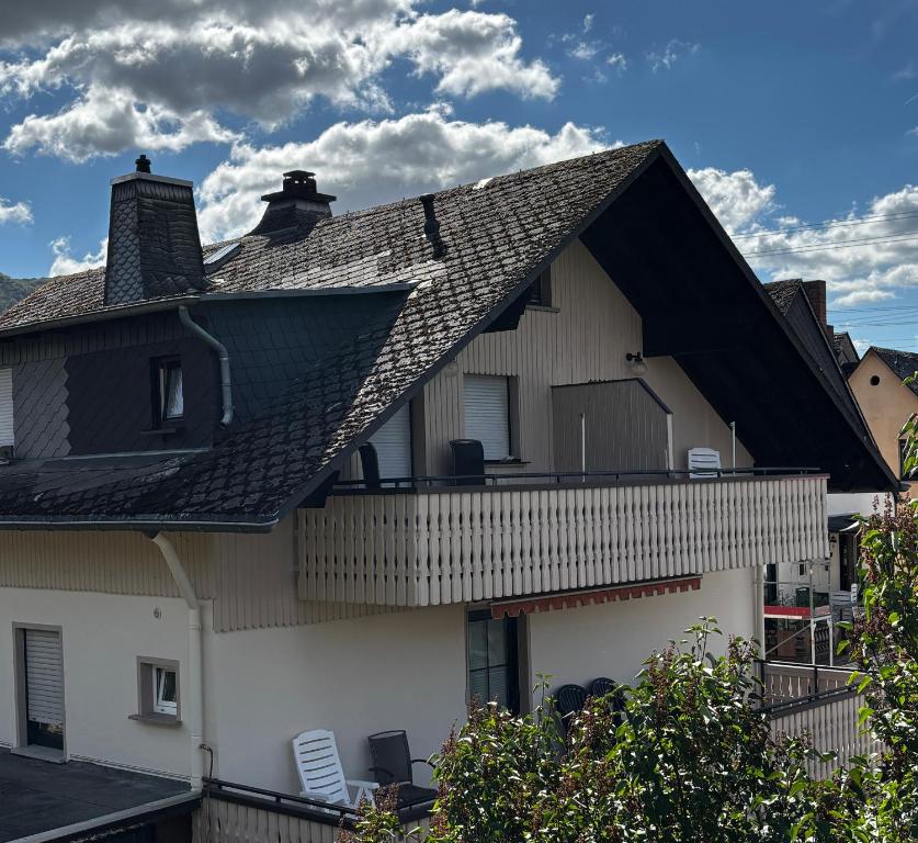 a house with a gambrel roof with a balcony at Gästehaus Neier in Boppard