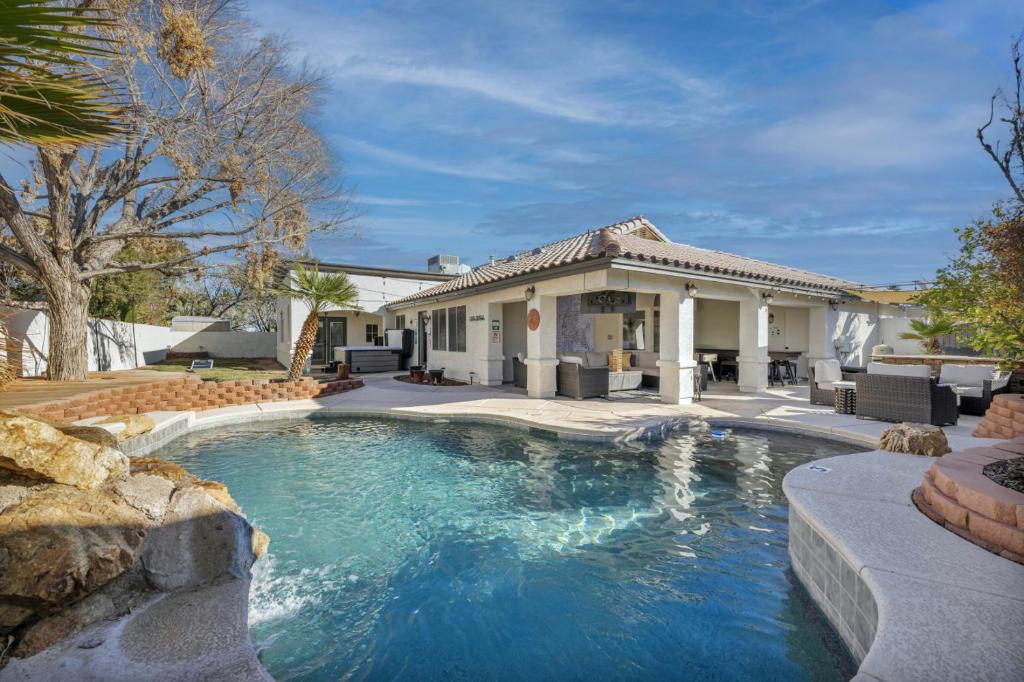 a swimming pool in the backyard of a house at Ultimate Vacation: A Luxurious Oasis with a Pool! in Las Vegas