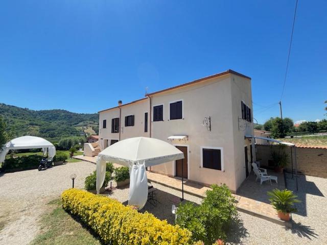 a building with an umbrella in front of it at CASALE PAGI’ in Grottammare
