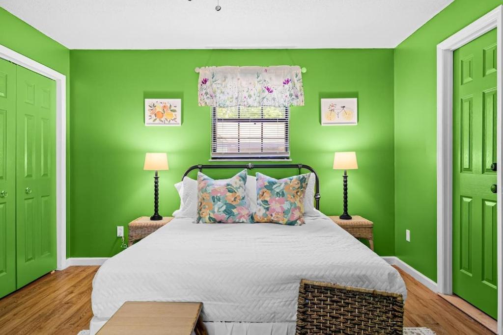 a green bedroom with a bed and two doors at 2 Bed 1 Bath Private Suite Funky Bunch TYSUT in Louisville