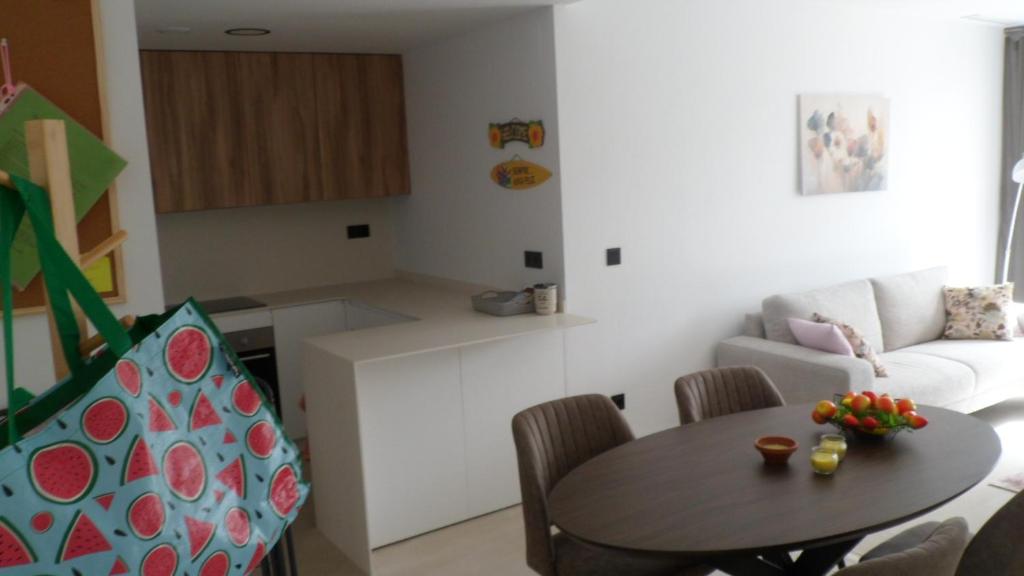a living room with a table and a couch at Villa Ceesito in Los Alcázares