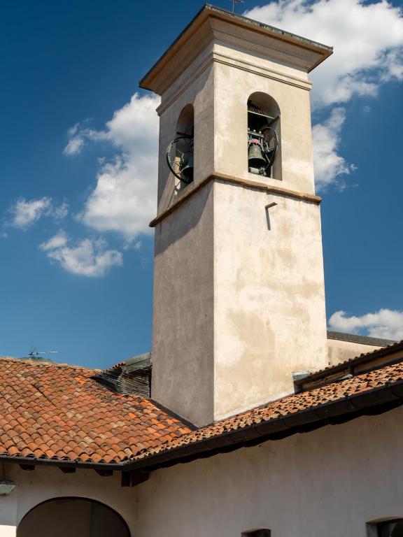 a clock tower on top of a building at Antico Monastero del Lavello in Calolziocorte