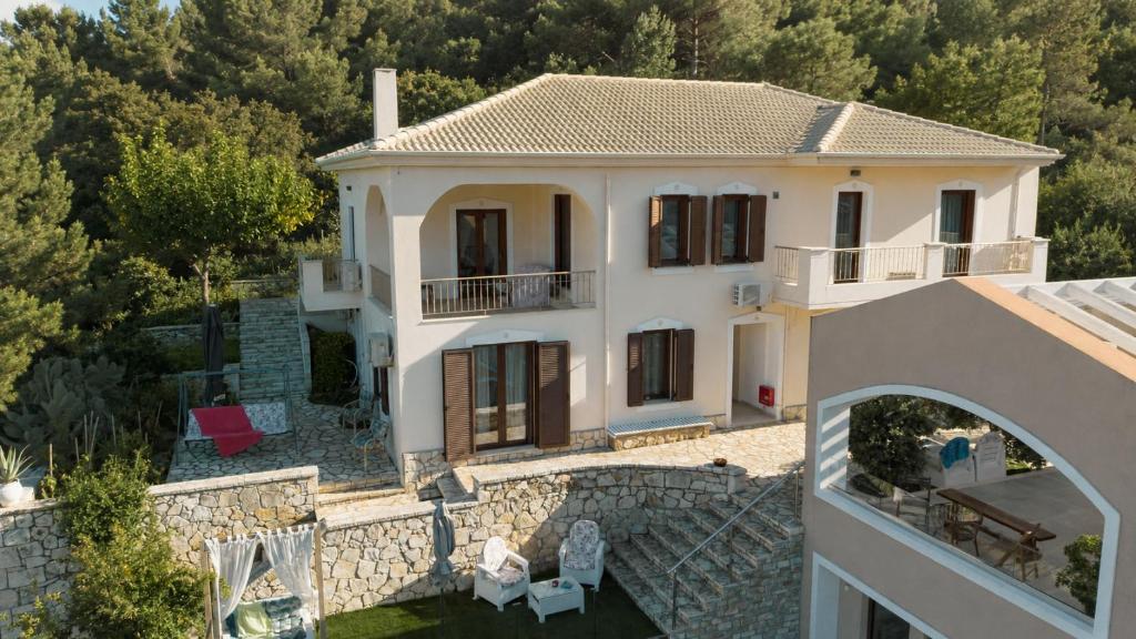 an aerial view of a villa with a house at Alex port view apartments in Syvota