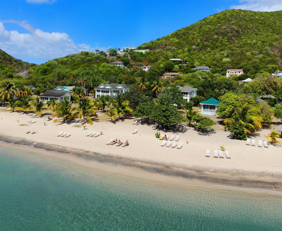 an aerial view of a beach with people sitting on chairs at Oualie Beach Resort in Nevis