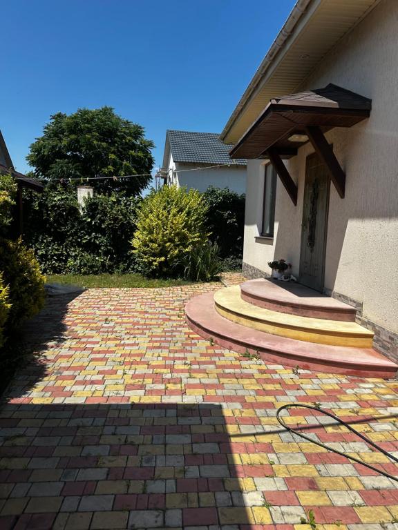 a brick driveway in front of a house at Арендное жилье Лиманка in Odesa