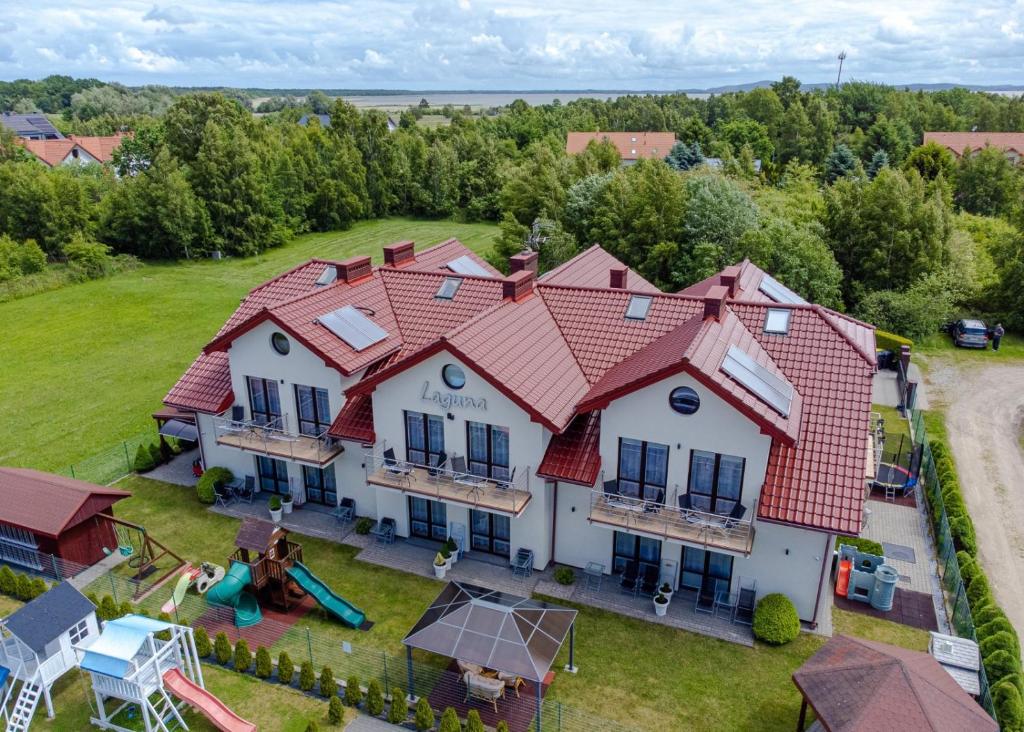 an aerial view of a house with a playground at Villa Laguna in Rowy