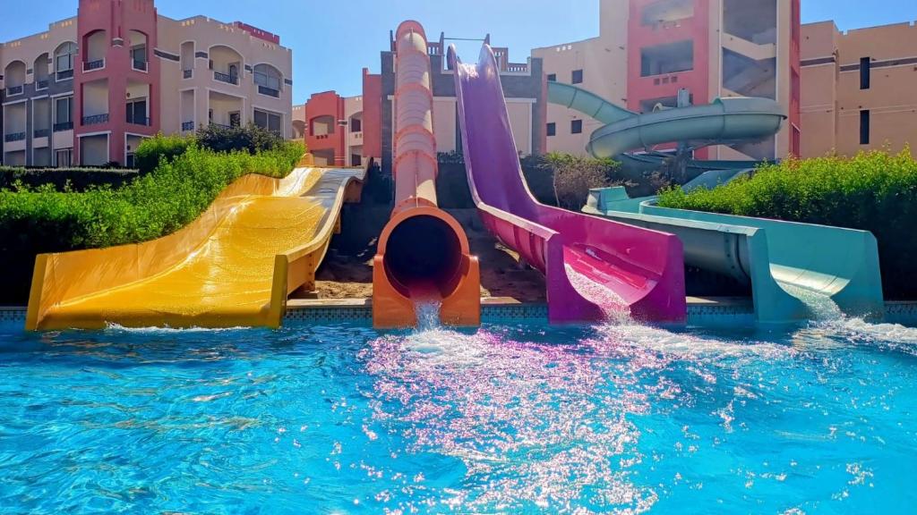 a water park with a slide in the water at Oyster Bay Beach Suites K7-14 in Marsa Alam City