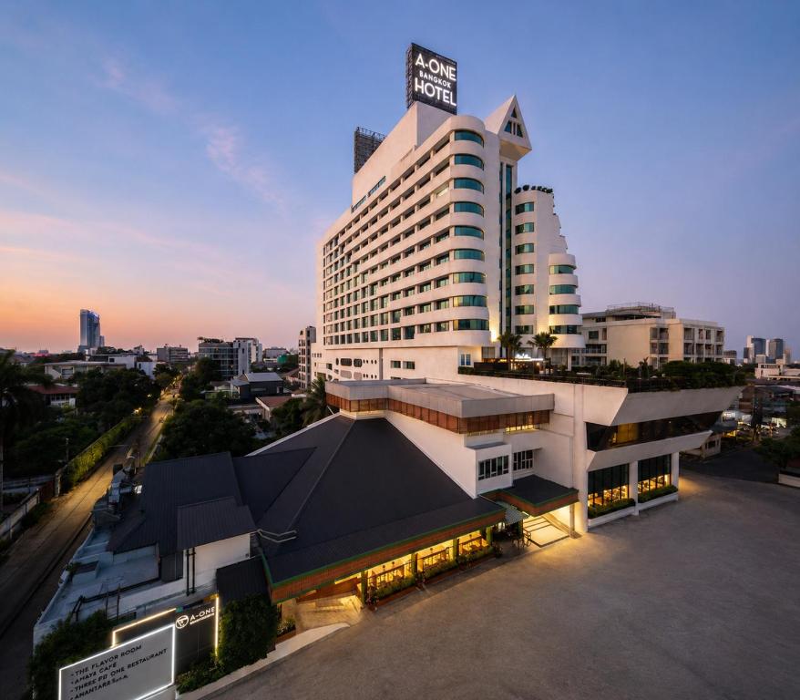 a building with a sign on the top of it at A-ONE Bangkok Hotel in Bangkok