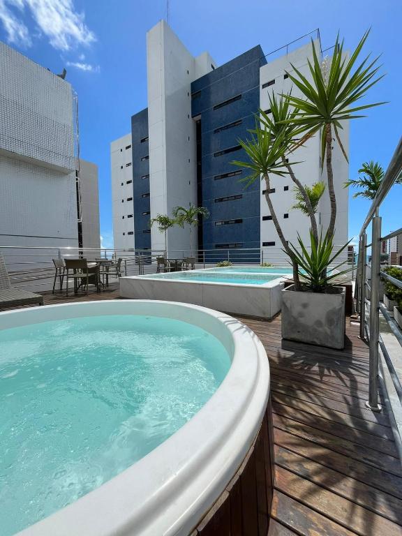 a swimming pool on top of a building at Flat Manaira Apart Hotel 1605 in João Pessoa