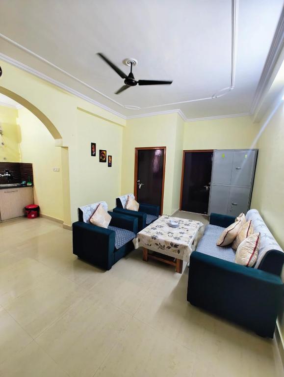 a living room with two couches and a coffee table at 2BHK Flat in Bhimtal in Bhowāli