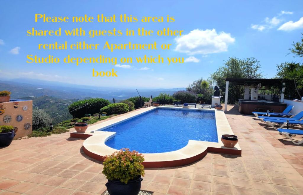 a quote about a swimming pool on a house at Vine Ridge Studio and Apartment in Comares
