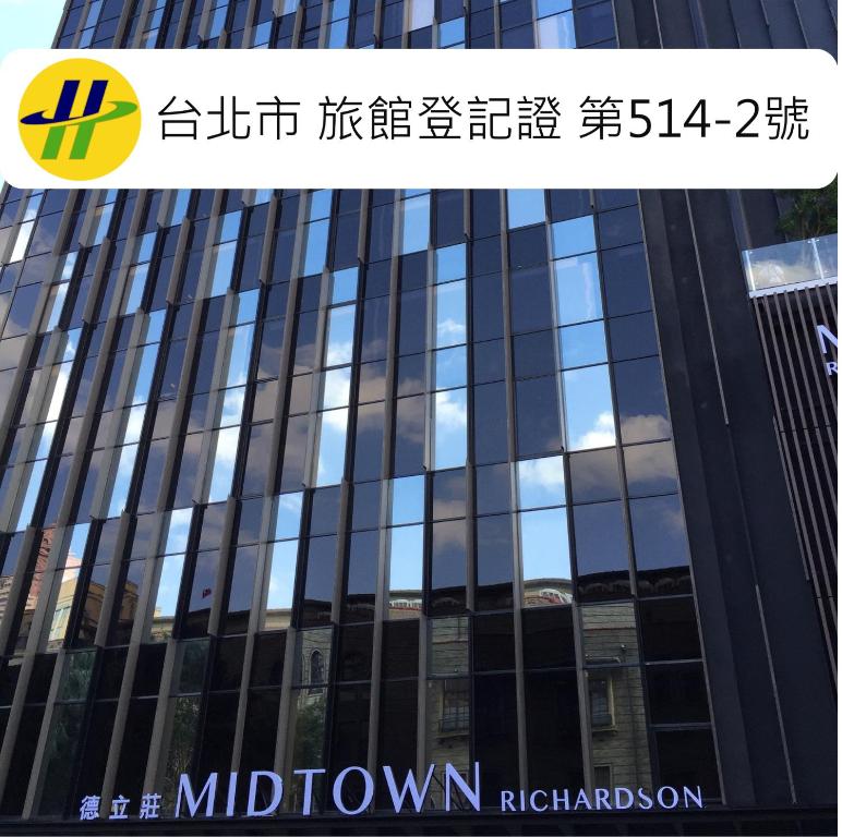 a glass facade of a building with the reflection of the sky at Hotel Midtown Richardson in Taipei