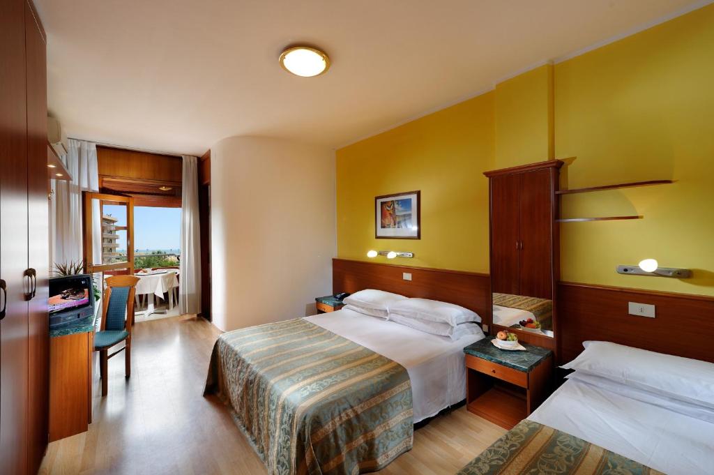 Postel nebo postele na pokoji v ubytování Hotel Bembo