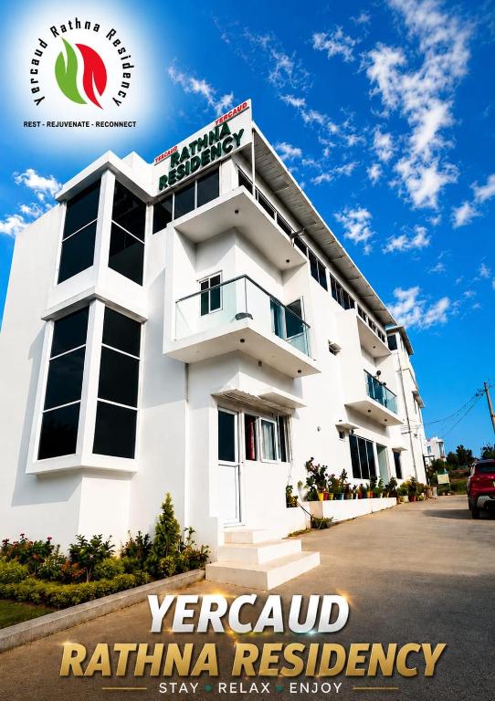 a rendering of a white building with the sign foryer road rattkin residency at Yercaud Rathna Residency in Yercaud