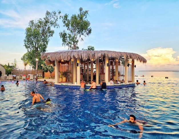 a group of people in the water in a swimming pool at 8 boulevard newtown mactan in Punta Engaño