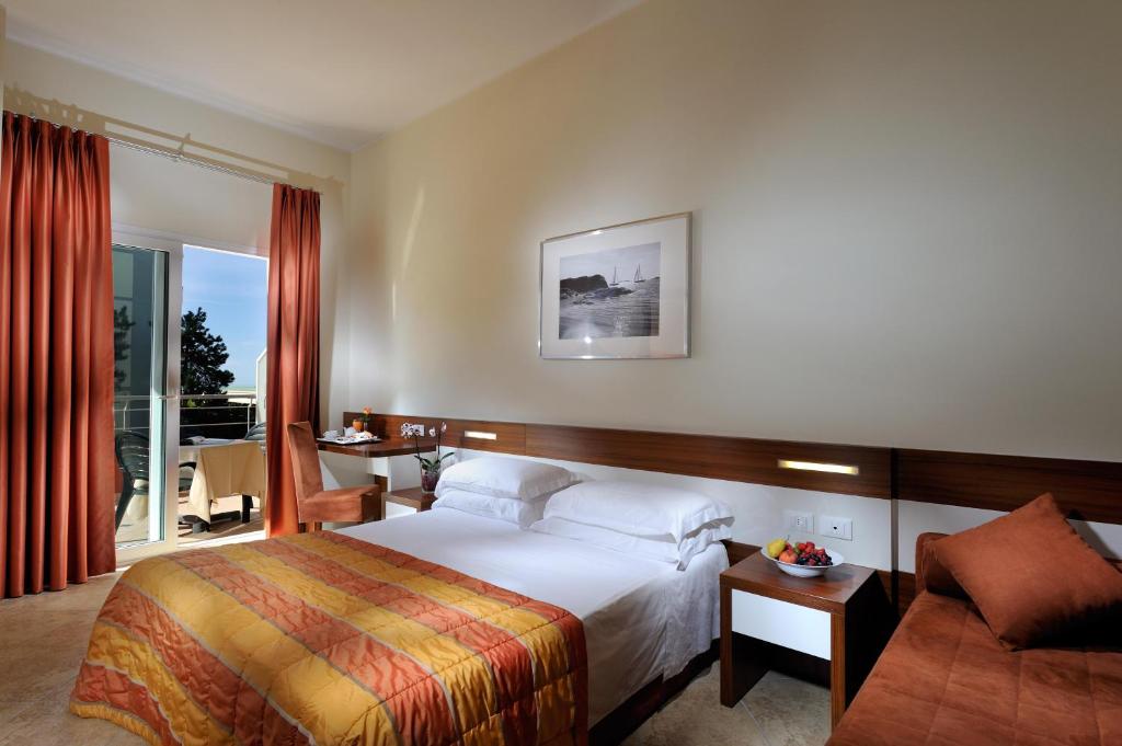 Postel nebo postele na pokoji v ubytování Hotel Bembo