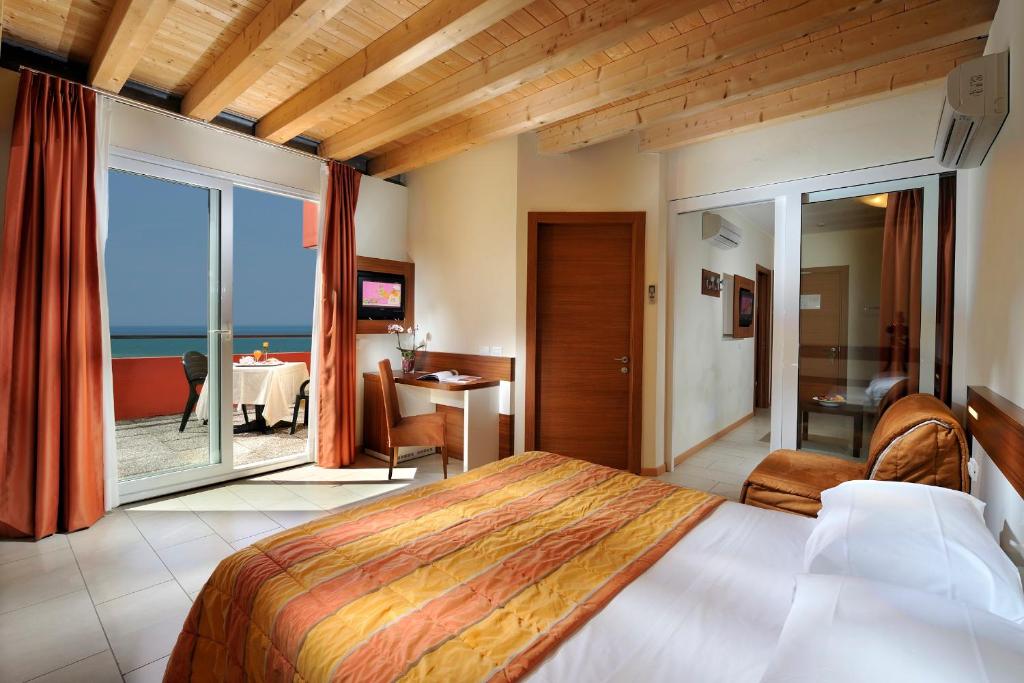 Postel nebo postele na pokoji v ubytování Hotel Bembo