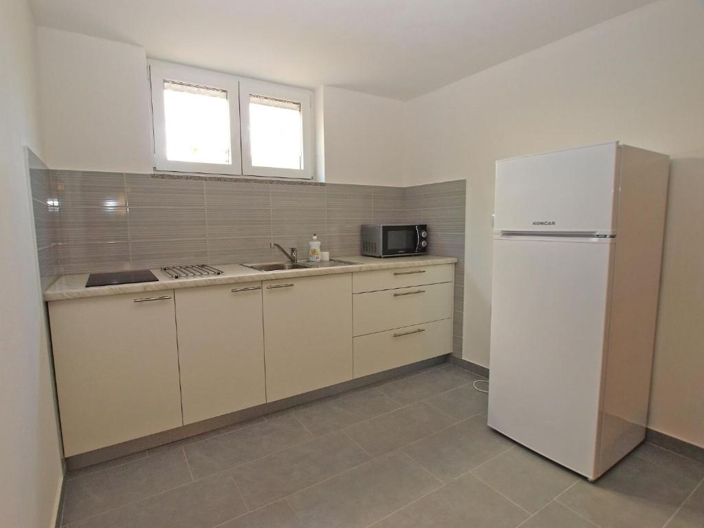 Kuchyň nebo kuchyňský kout v ubytování Apartments Dragica 927