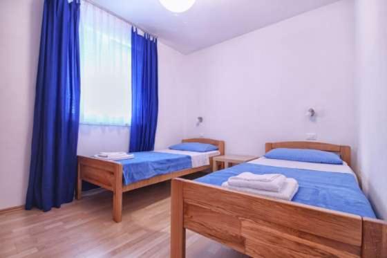 Postel nebo postele na pokoji v ubytování Apartments Dragica 927