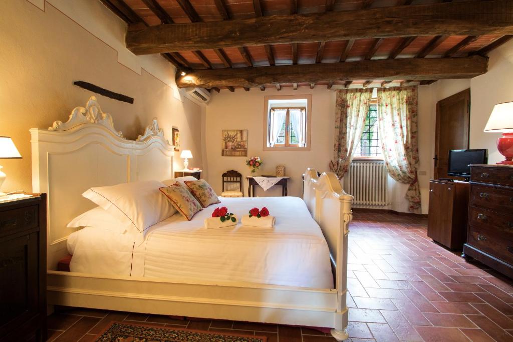 Postel nebo postele na pokoji v ubytování Hotel Belvedere Di San Leonino