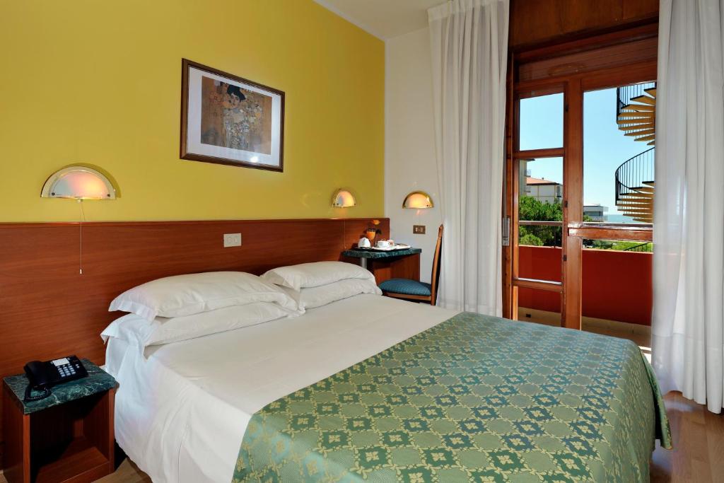 Postel nebo postele na pokoji v ubytování Hotel Bembo