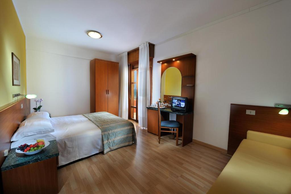 Postel nebo postele na pokoji v ubytování Hotel Bembo