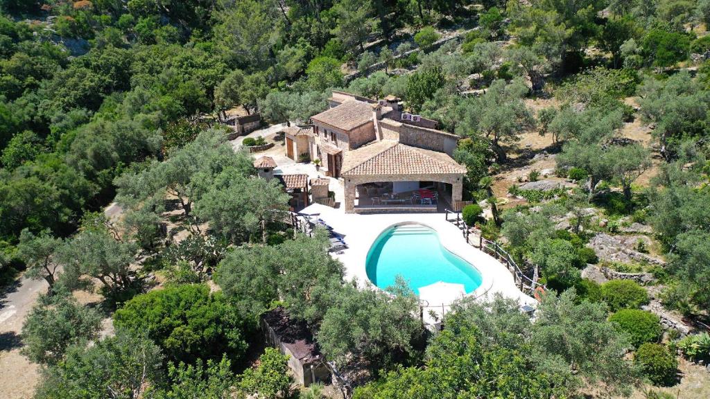 an aerial view of a house with a swimming pool at Villa Alordes in Pollença