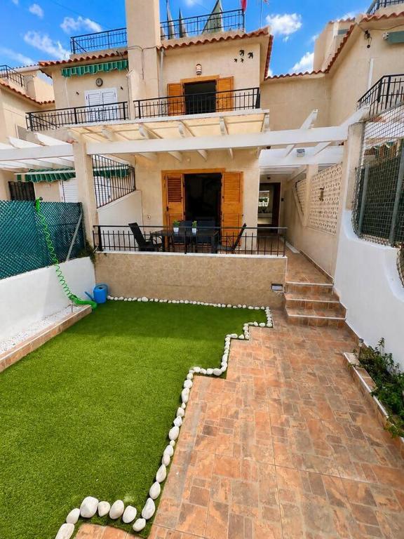 a large house with a lawn in front of it at Villa Belén . in El Moncayo