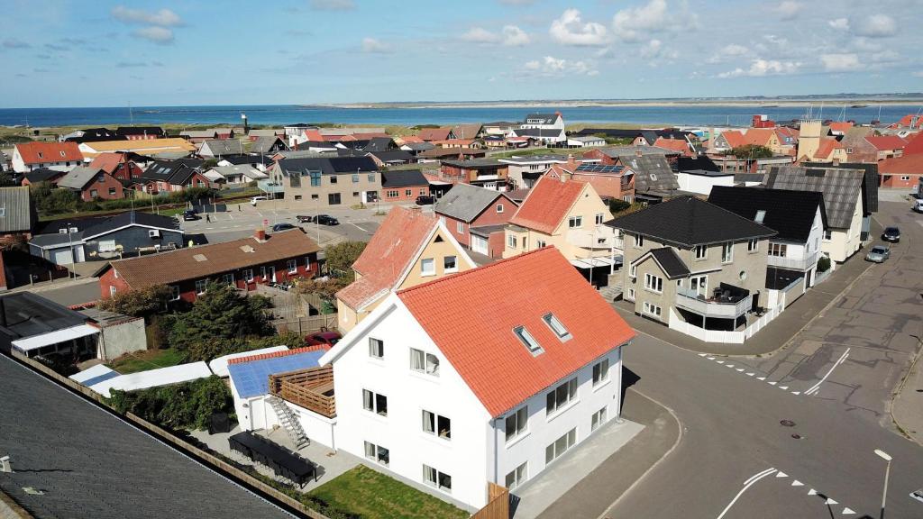 an aerial view of a town with buildings and the ocean at Activity House With Wellness Area-Sj700 in Thyborøn