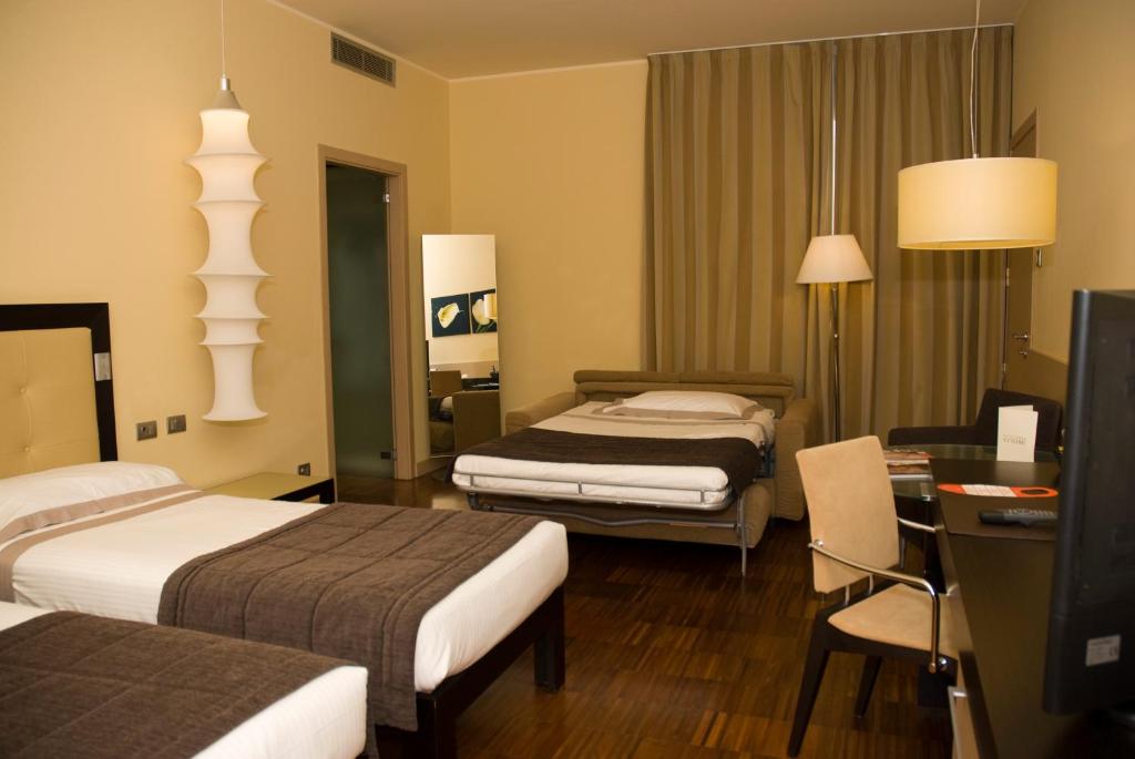 Ένα ή περισσότερα κρεβάτια σε δωμάτιο στο Hotel Cruise