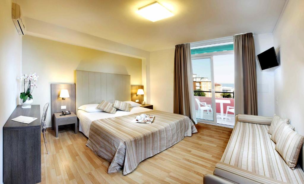 Postel nebo postele na pokoji v ubytování Hotel Bembo