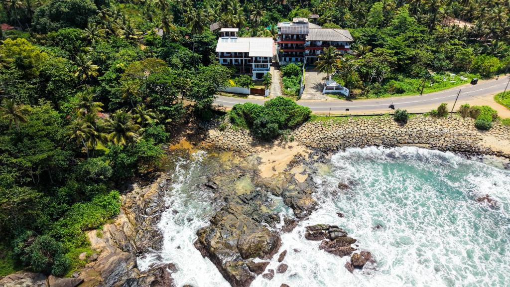 an aerial view of a beach and the ocean at Coastal Breeze Talalla in Talalla South