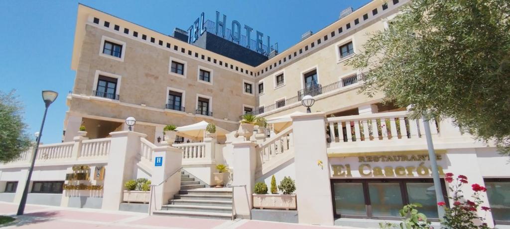 a large building with stairs in front of it at Hotel Conde Ansúrez in Valladolid