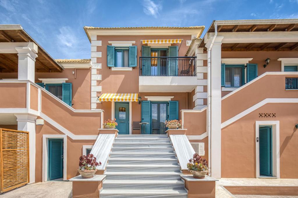 a house with stairs in front of it at Armeno Resort in Marathias