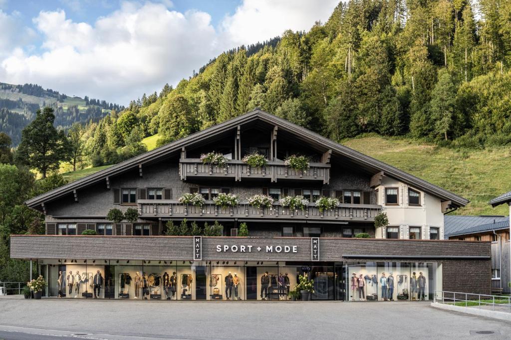a store front of a hotel in the mountains at Pension Matt in Schoppernau
