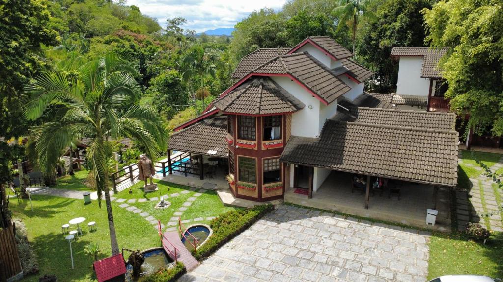 an aerial view of a house with a garden at Pousada Viking Penedo in Penedo