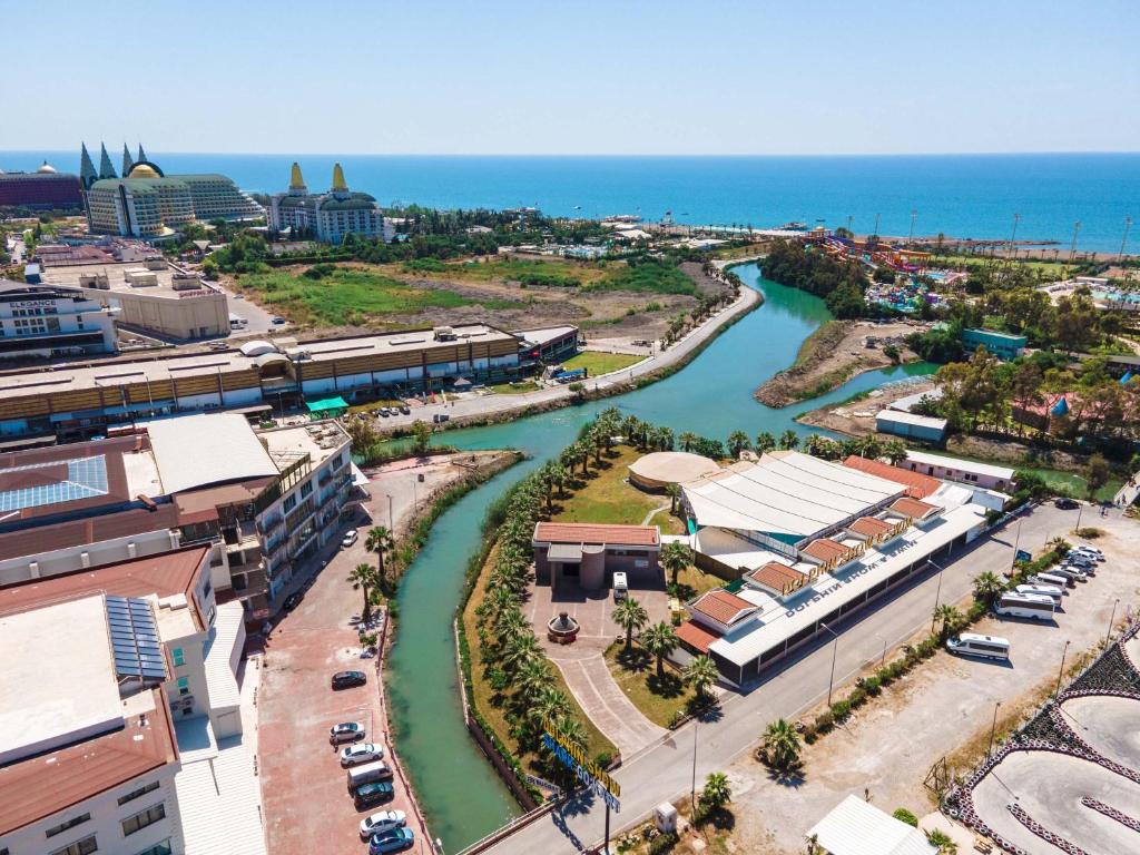 an aerial view of a city with a river at Riversea Suite & Hotel in Lara