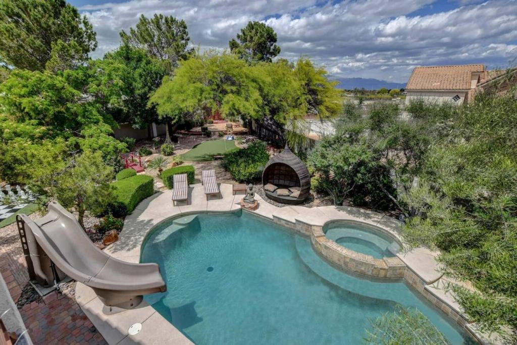 an overhead view of a swimming pool in a backyard at Summerlin Private Buddha Estate Resort - Pool, Spa, Sauna, Game Room, Basket ball, Mini golf, Gym in Las Vegas