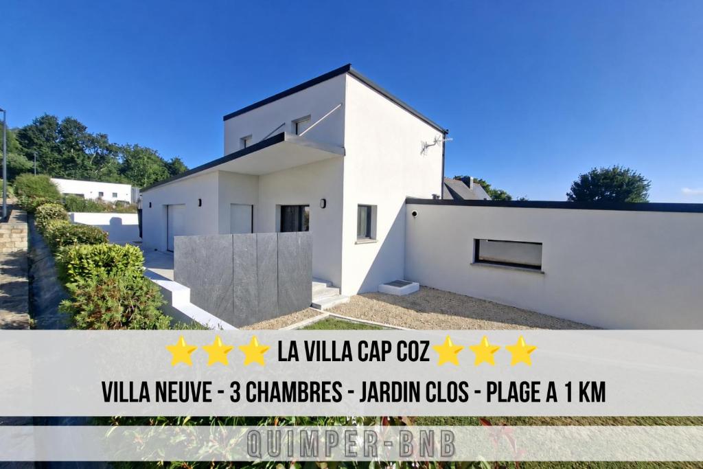 a white house with yellow stars on it at LA VILLA CAP COZ - 3 Chambres - Plage à 800 m in Fouesnant