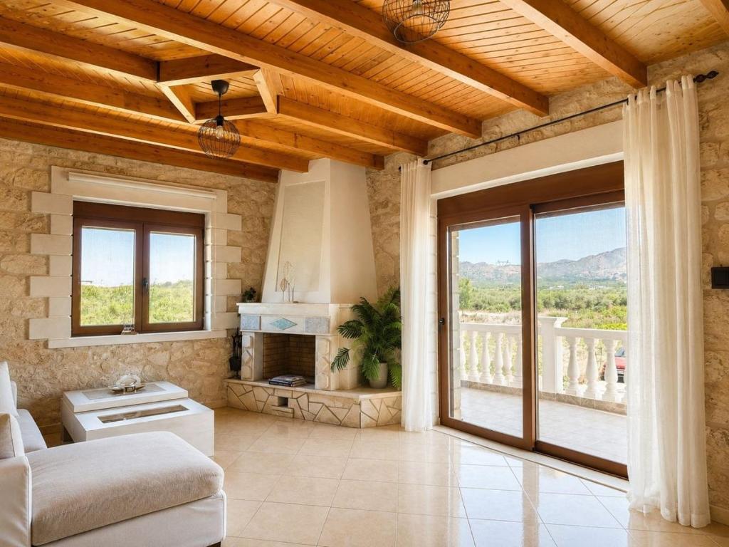 a living room with a couch and a fireplace at Cretan Nature Stone Apartment in Ayiás Filakaí